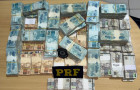 R$ 994 mil em espécie escondidos em compartimentos secretos de SUV em Araguaína; motorista deu versões contraditórias sobre origem do dinheiro.